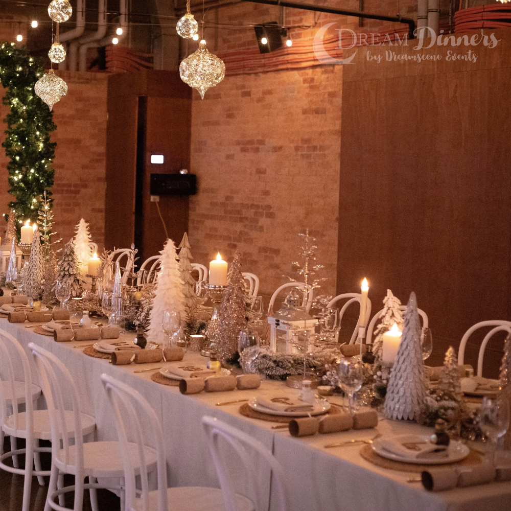 Long table with Christmas table setting decorations for Christmas party